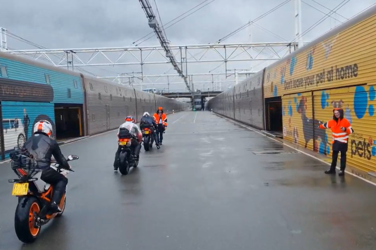 Motorcyclist in line before entering the train