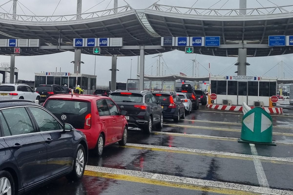 Cars and motorcycles queuing at the LeShuttle terminal check-in before boarding the Channel Tunnel train