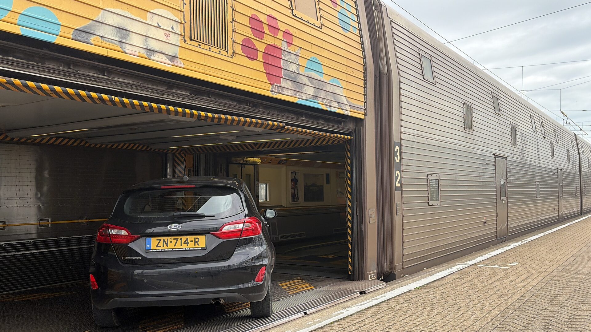 Car entering a double-deck LeShuttle carriage through the loading door