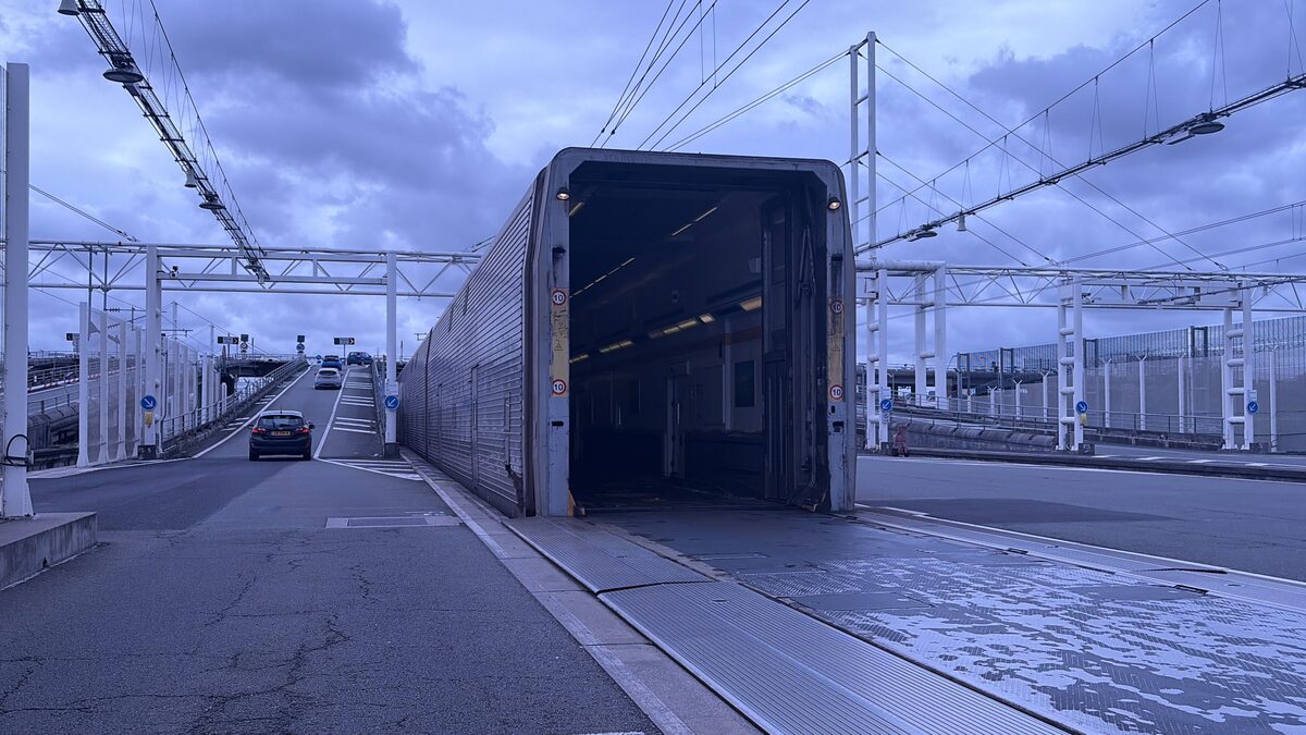 Cars driving off the LeShuttle train at the Calais Coquelles terminal