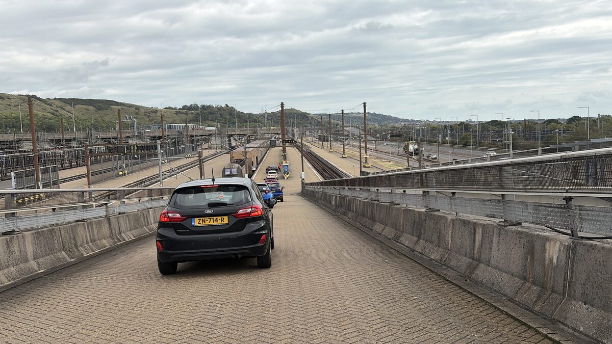 Cars driving along the platform towards the LeShuttle train at Folkestone