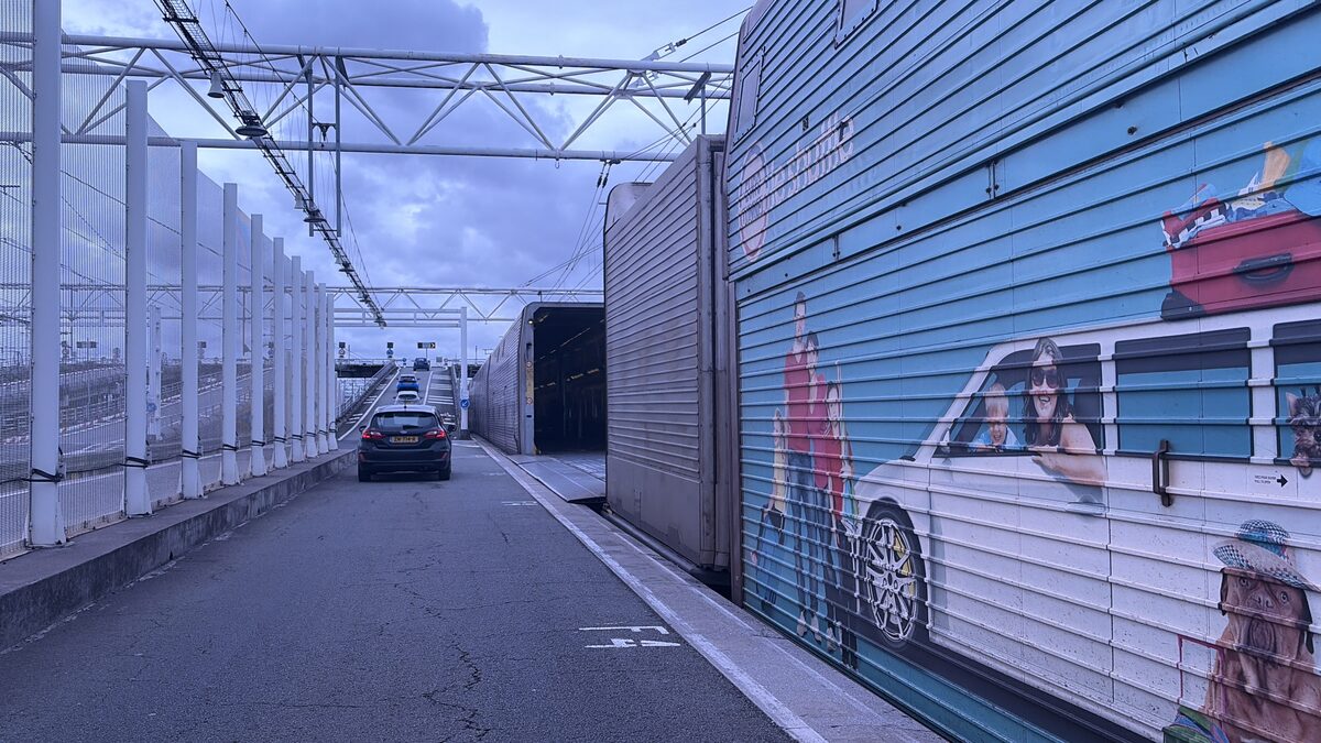 Cars driving off the LeShuttle train at the Calais Coquelles terminal