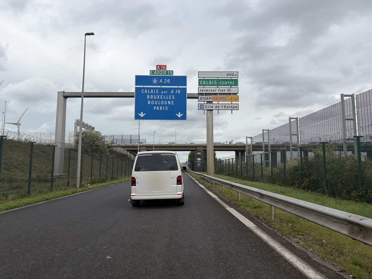 Motorway direction signs for the A16 and A26 on the exit road at the Calais terminal