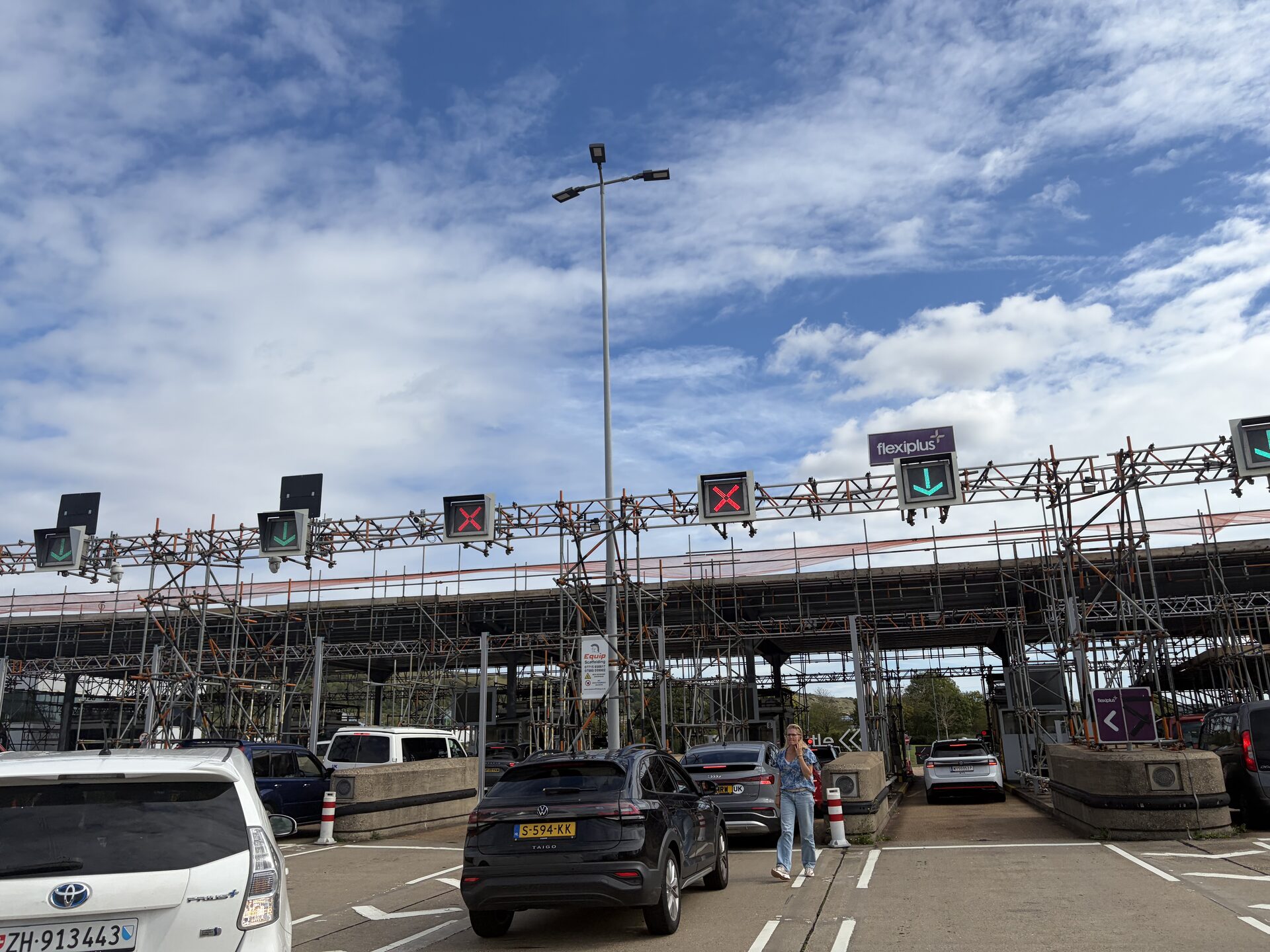 Check-in lanes with overhead gantry and queuing cars at the LeShuttle Folkestone terminal