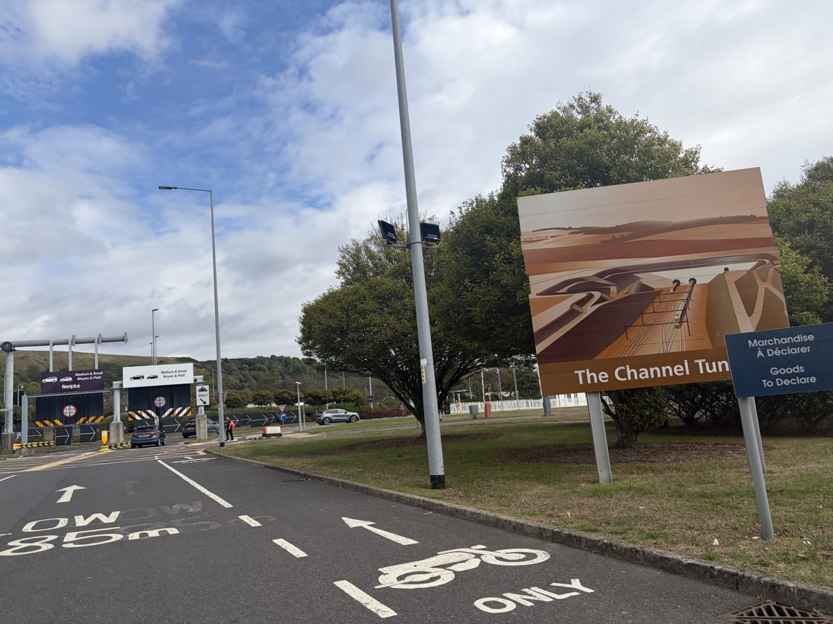 Road after passport control at Folkestone with Goods To Declare sign and motorcycle lane marking