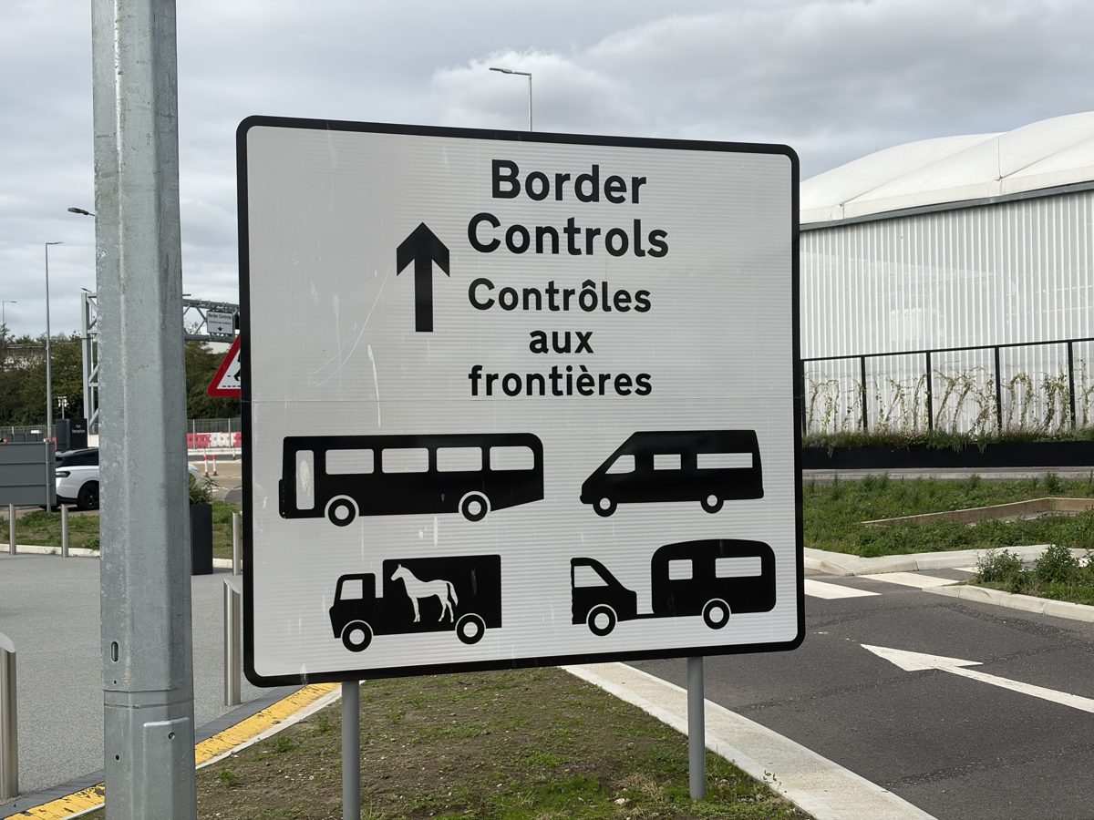 Border Controls sign at Folkestone with pictograms for coaches, vans, horseboxes and motorhomes