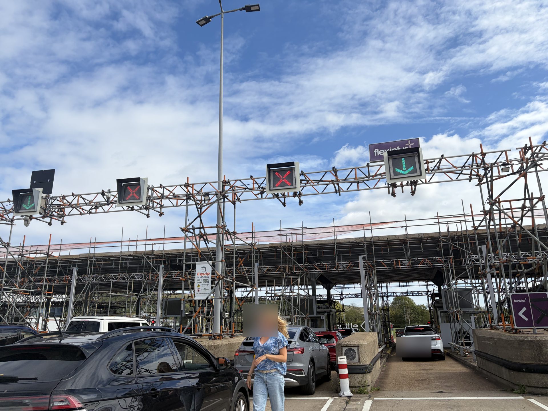 Check-in lanes with overhead gantry and queuing cars at the LeShuttle Folkestone terminal