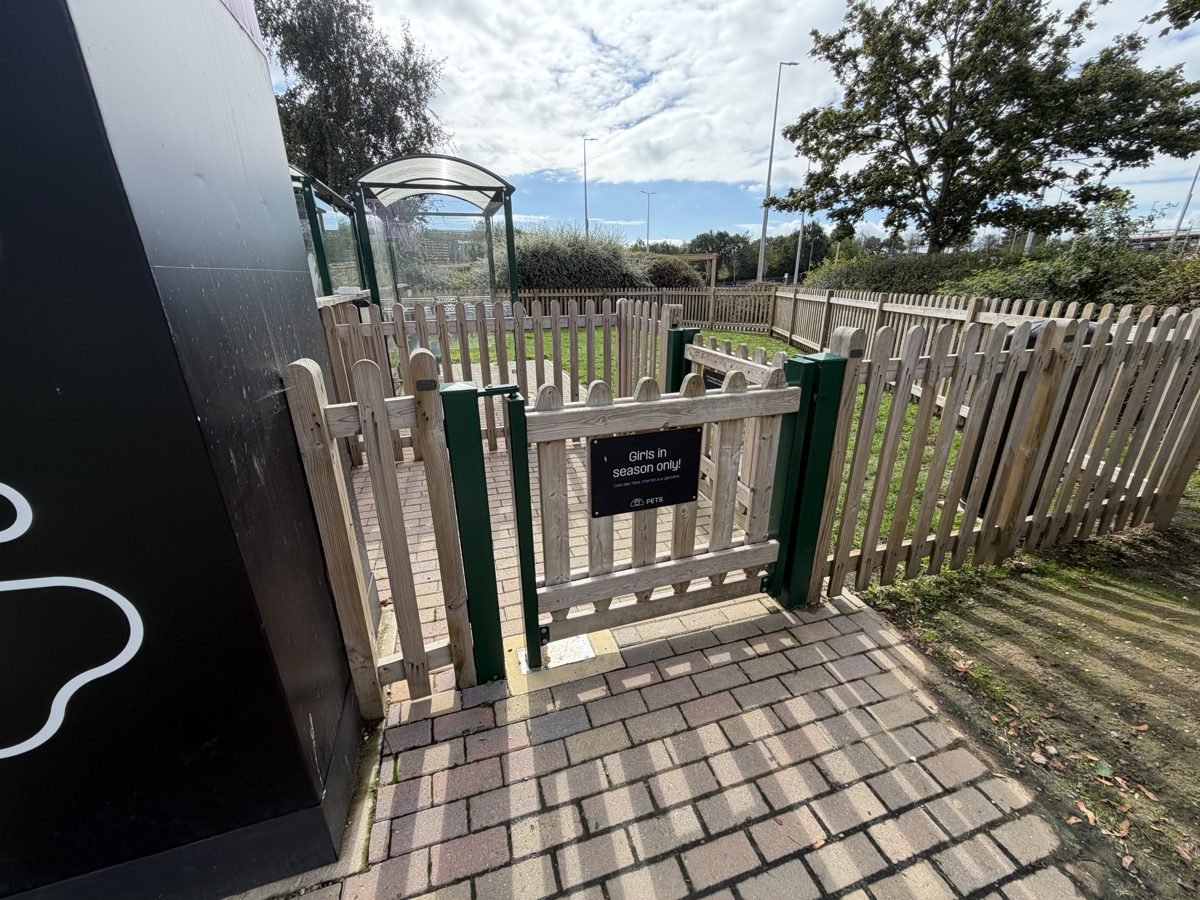 Fenced dog exercise pen at Folkestone marked for female dogs in season