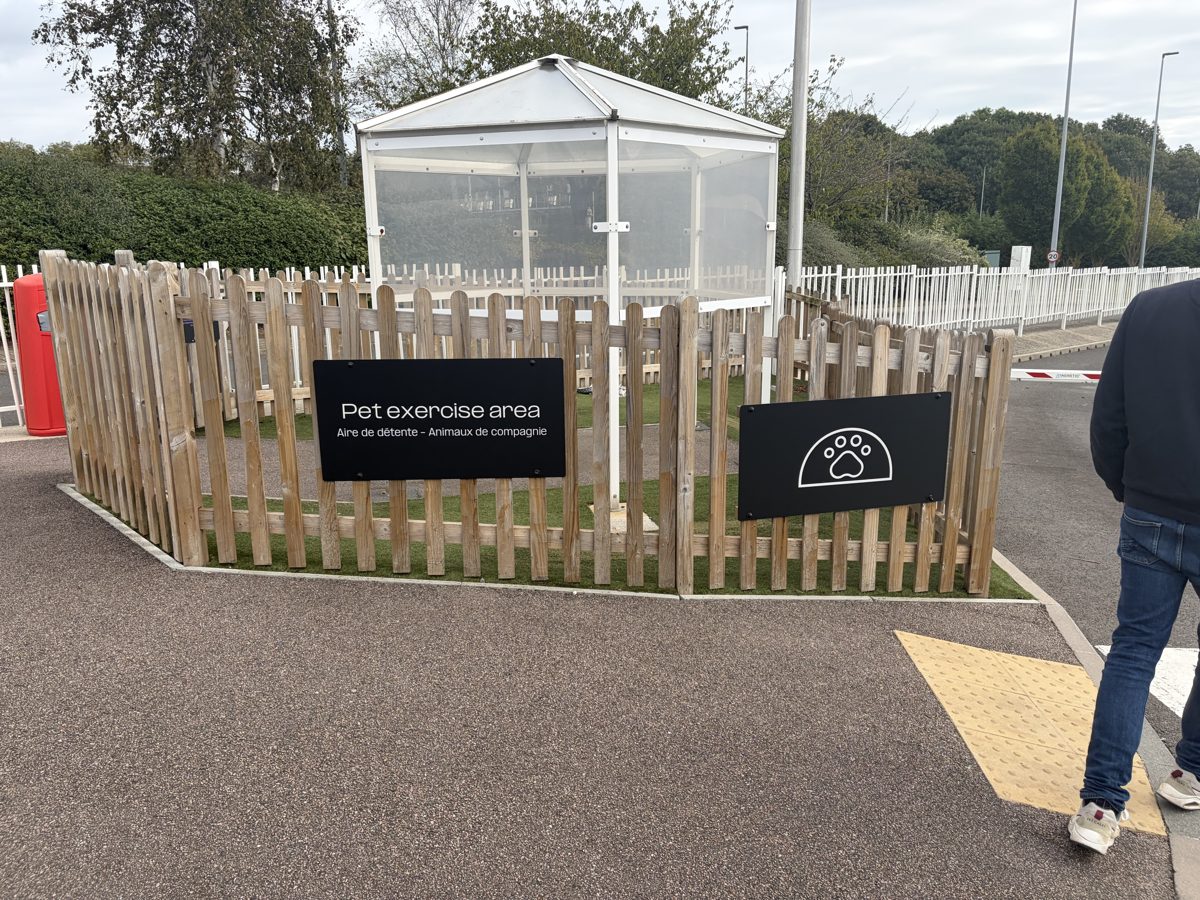 Fenced pet exercise area beside the Flexiplus lounge at Folkestone