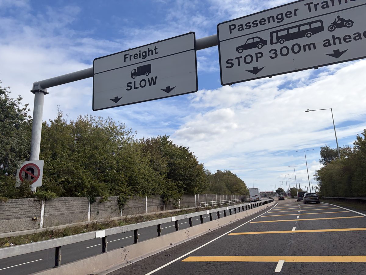 Overhead sign at Folkestone reading Freight Slow and Passenger Traffic Stop 300 m ahead