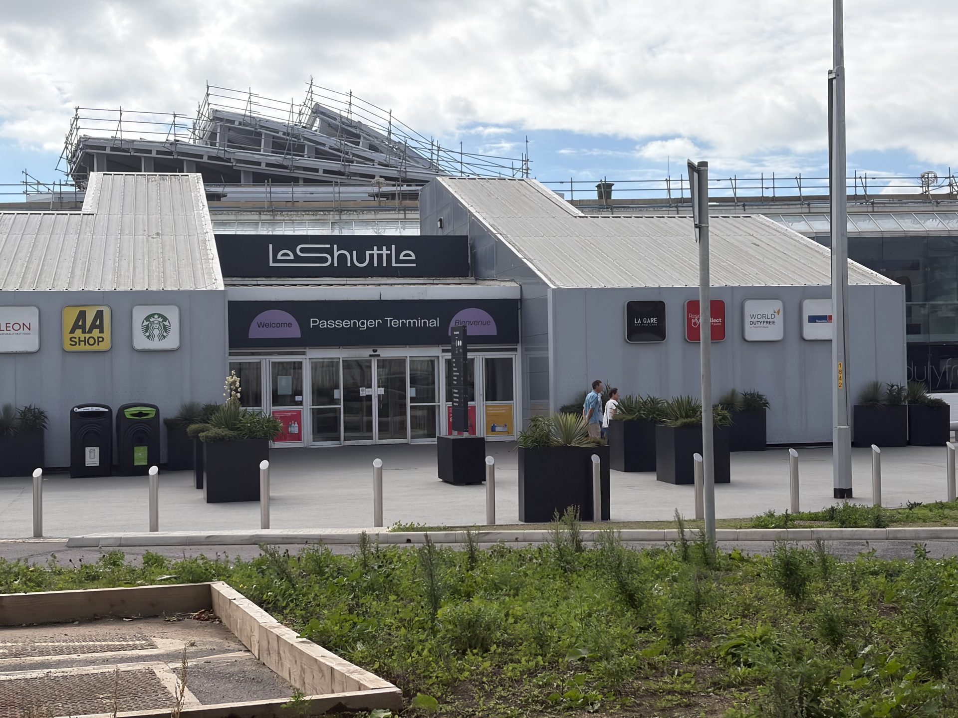Entrance to the LeShuttle passenger terminal at Folkestone with shop signs