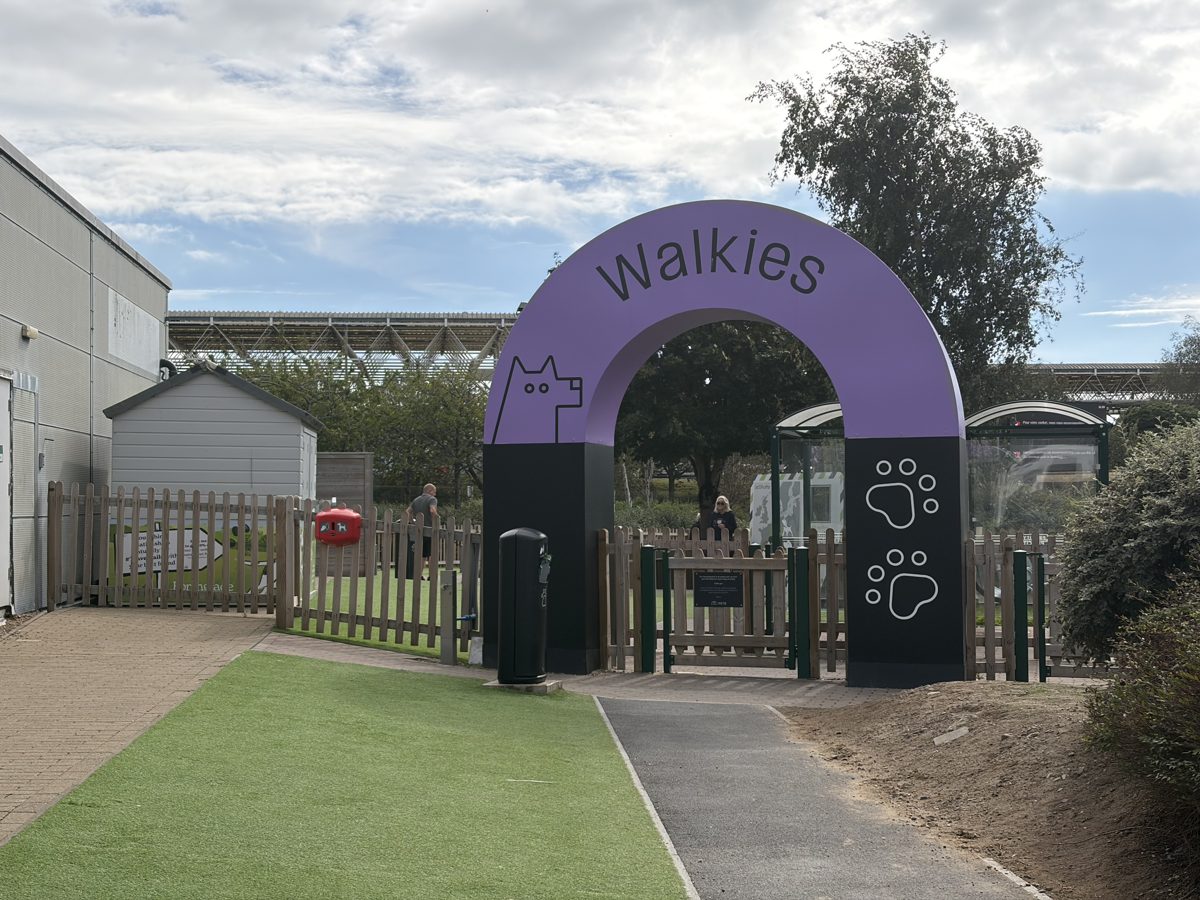 Walkies dog exercise area with purple arch next to the Folkestone passenger terminal